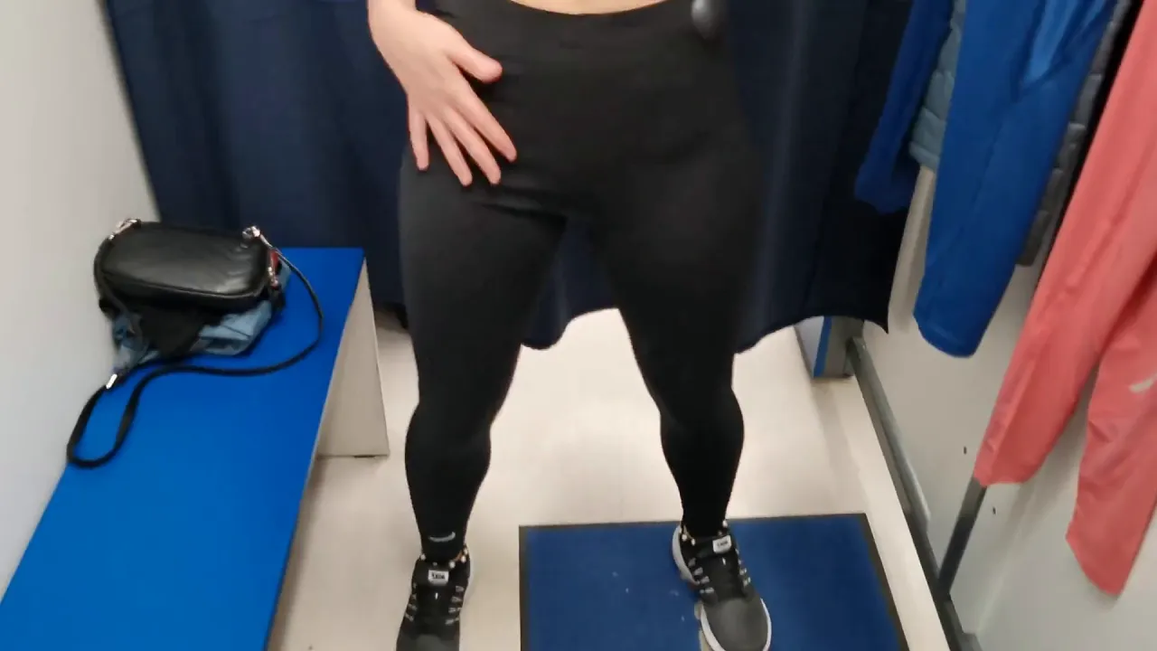 Solo babe tries on workout leggings in fitting room
