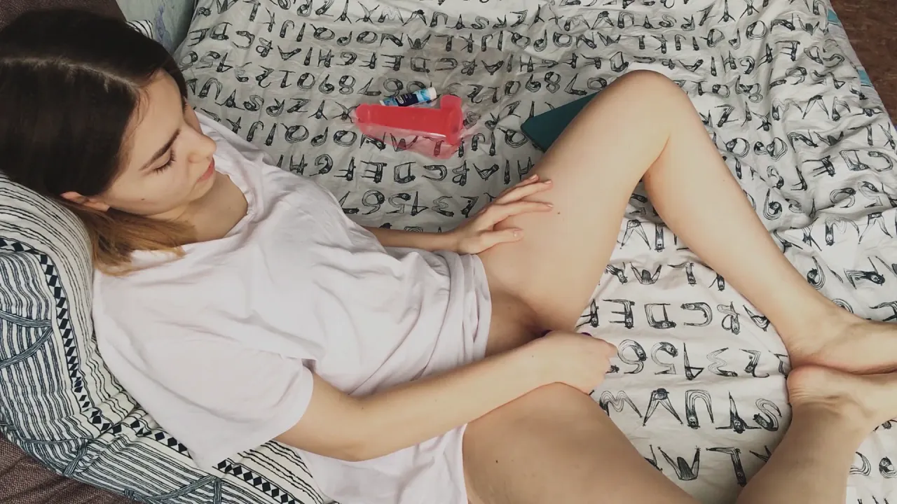 Petite brunette amateur plays with vibrator and gives herself a handjob