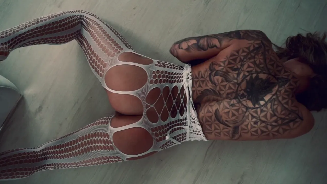 Tattooed woman masturbates to a dream of fisting and handjobs