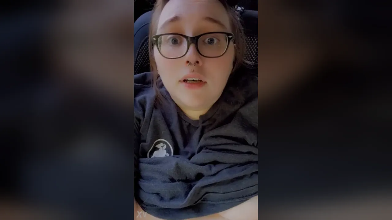 Maplekisses plays with a toy in a public parking lot