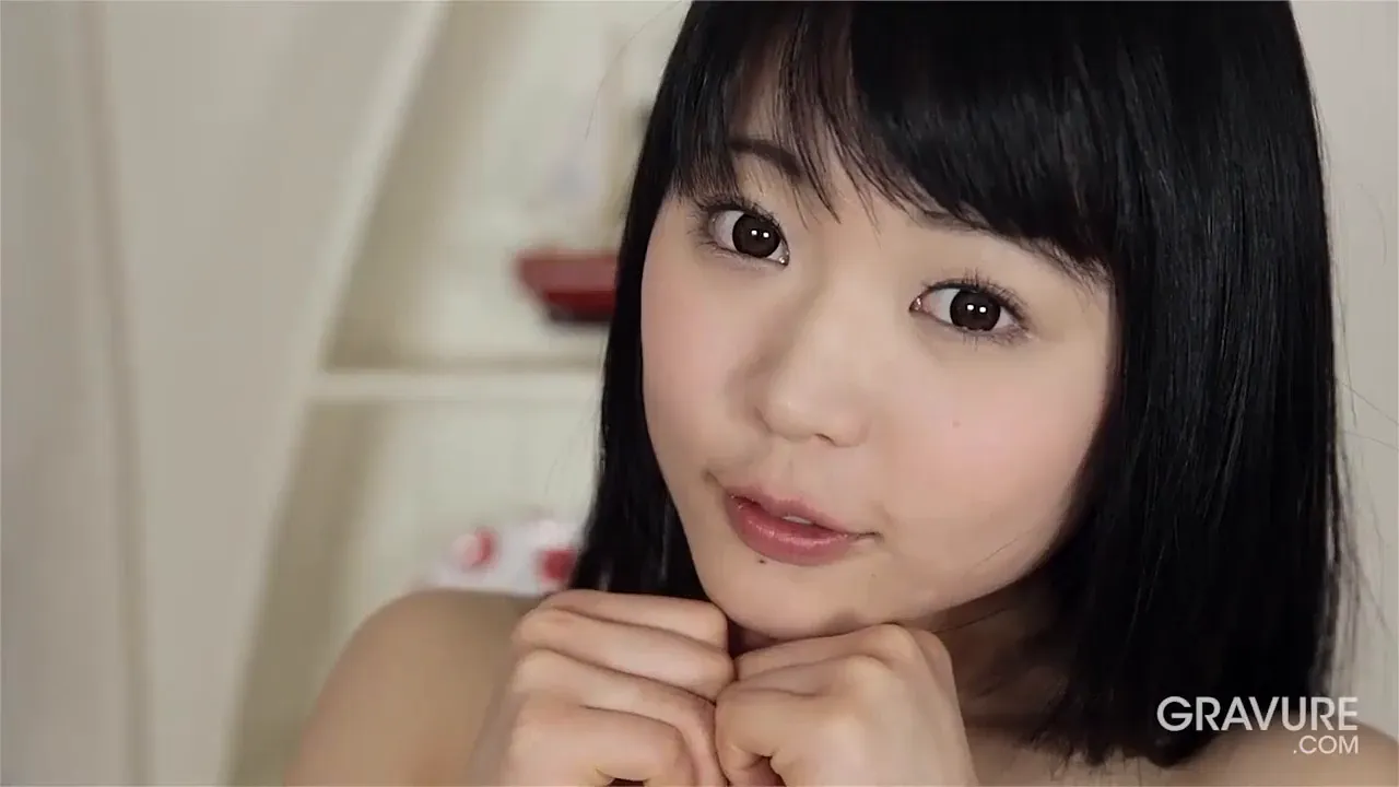 Solo Japanese brunette Yui Kawagoe poses and plays with her small tits and pussy