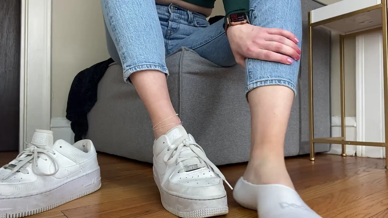 Young solo woman teases her dirty feet and soles