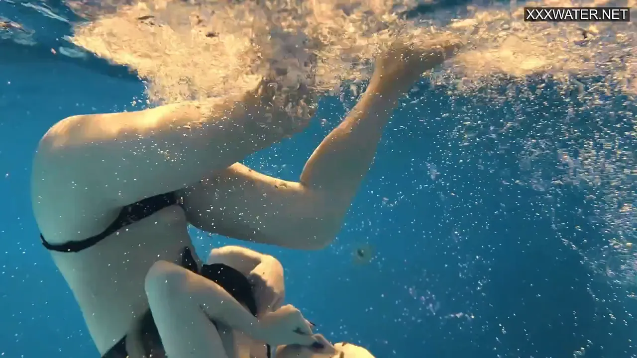 Blonde girl with big tits and ass enjoys naked swimming solo