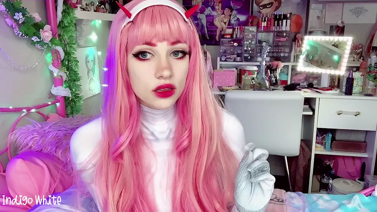 Pro cosplay girl Indigo White gets a POV blowjob from her sex machine toy