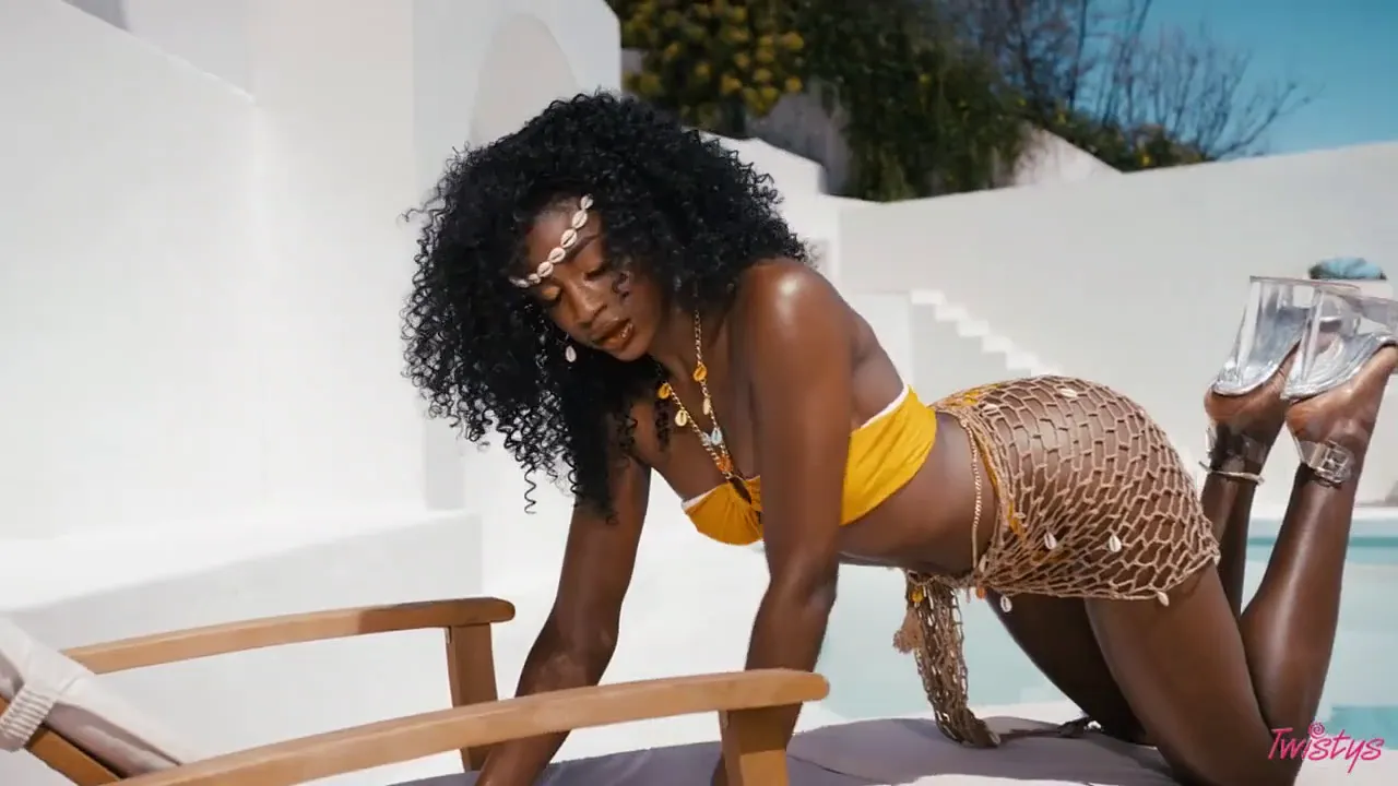 Ebony Nicole Kitt plays with her natural tits and shaved pussy in a solo outdoor scene