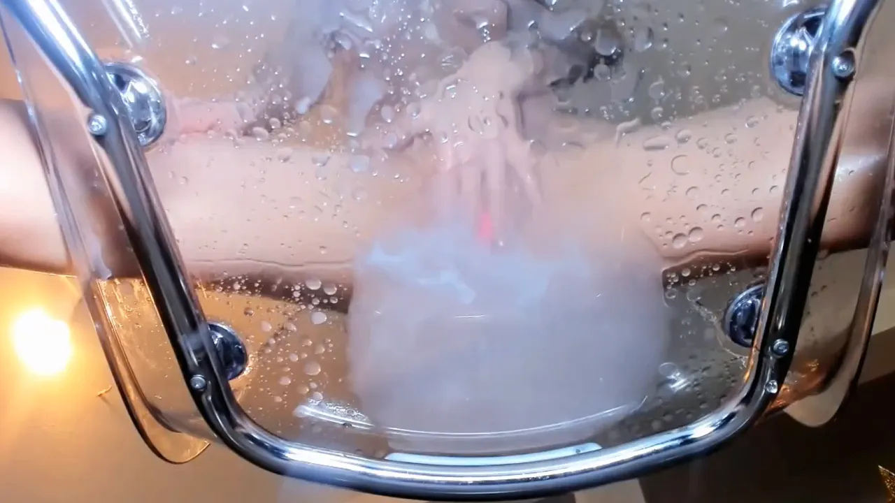 Busty hottie uses a lovense lush to please her shaved pussy and squirts on a glass seat