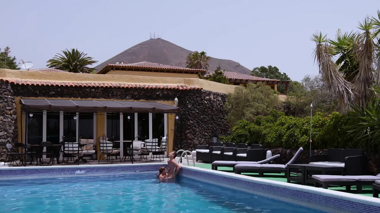Horny small-titted babe sucks cock and has sex in public by the pool