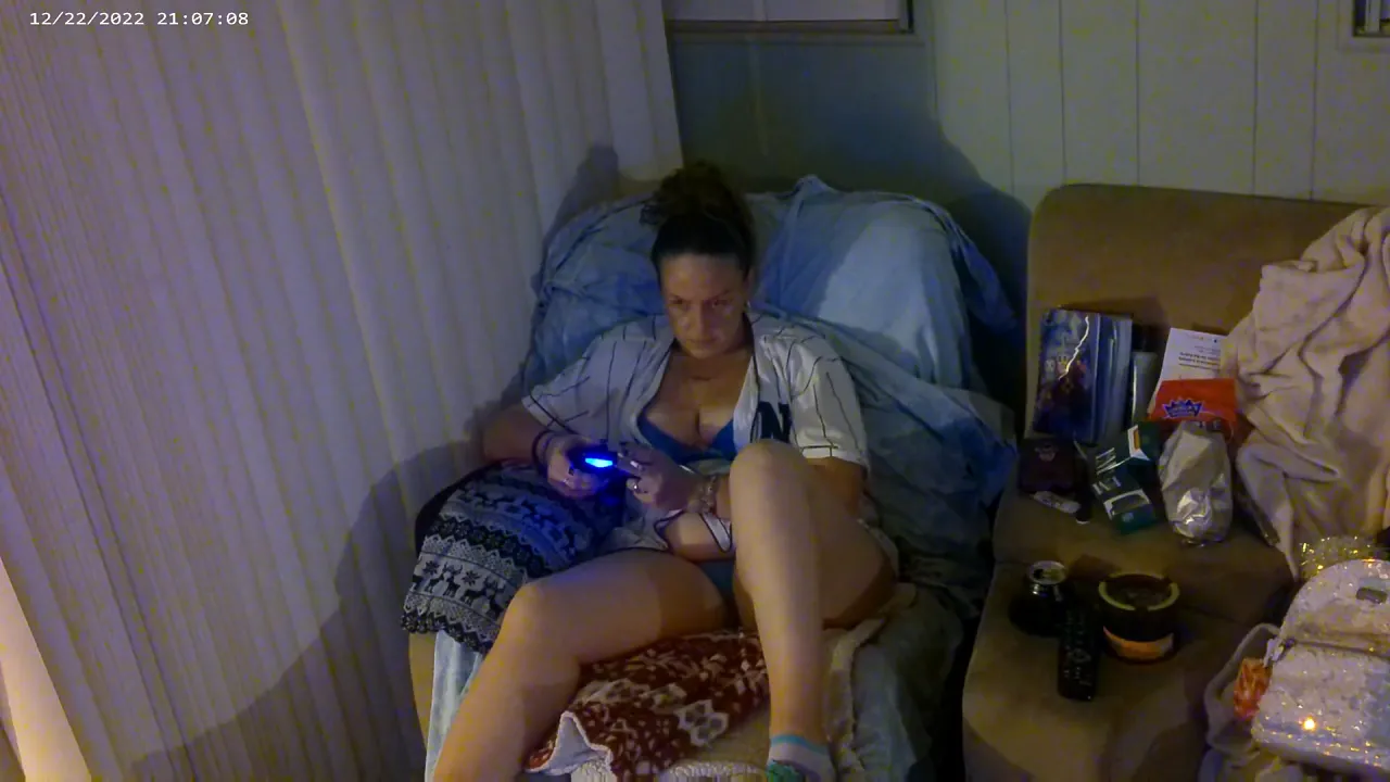 Busty gamer girl smokes and shows off her big ass, tits and panties