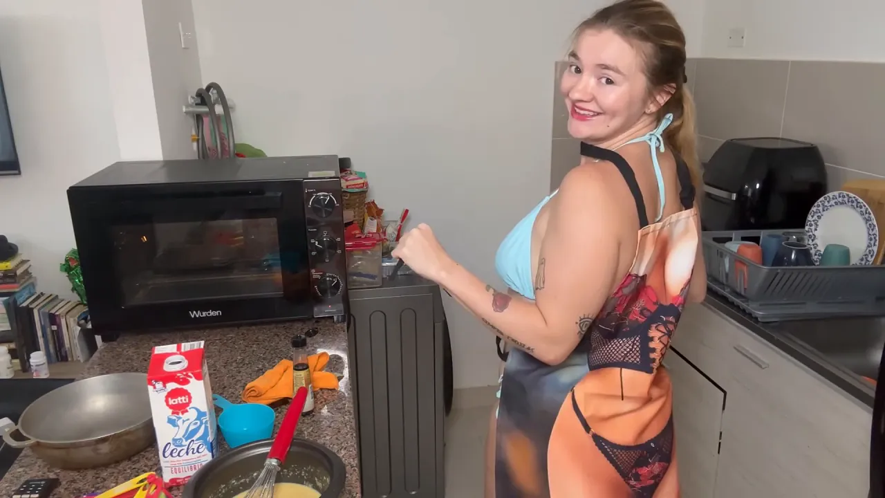 Blonde babe Emily Rose bakes blueberry muffins in bikini