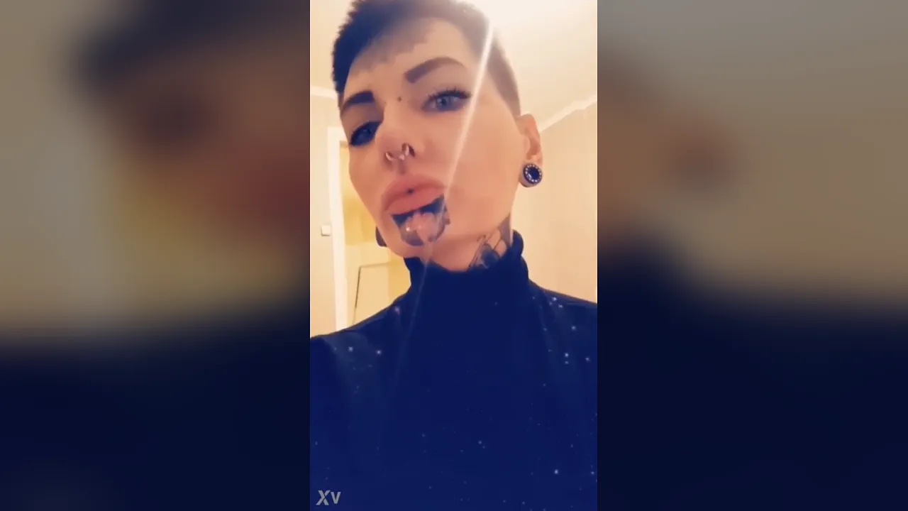 Glamorous tattooed woman verifies her identity in a video