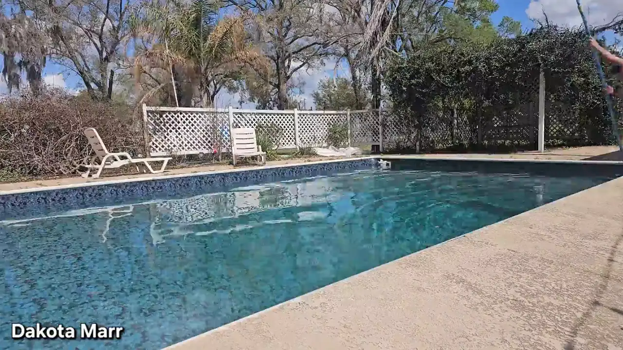 Dakota Marr flashes her pussy piercing at the swimming pool