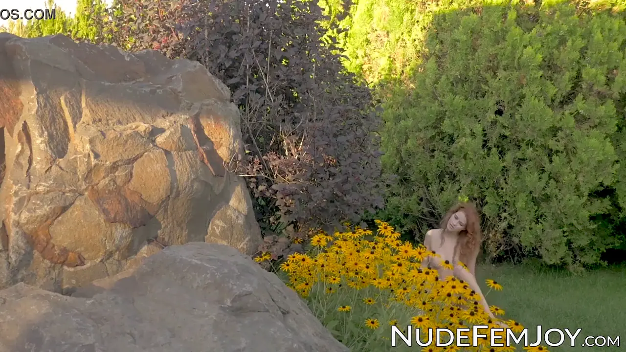 Redheaded nude solo tease outdoors