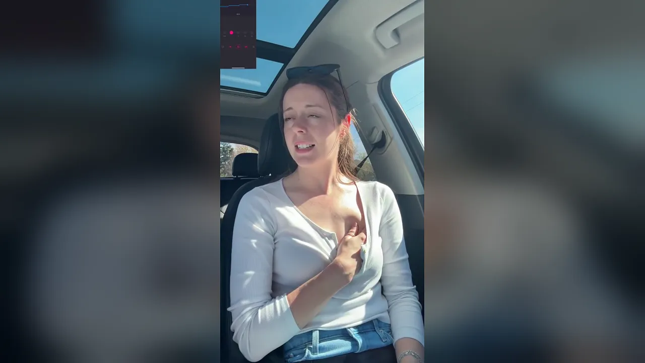 Brunette masturbates with a vibrator in her car at the car wash