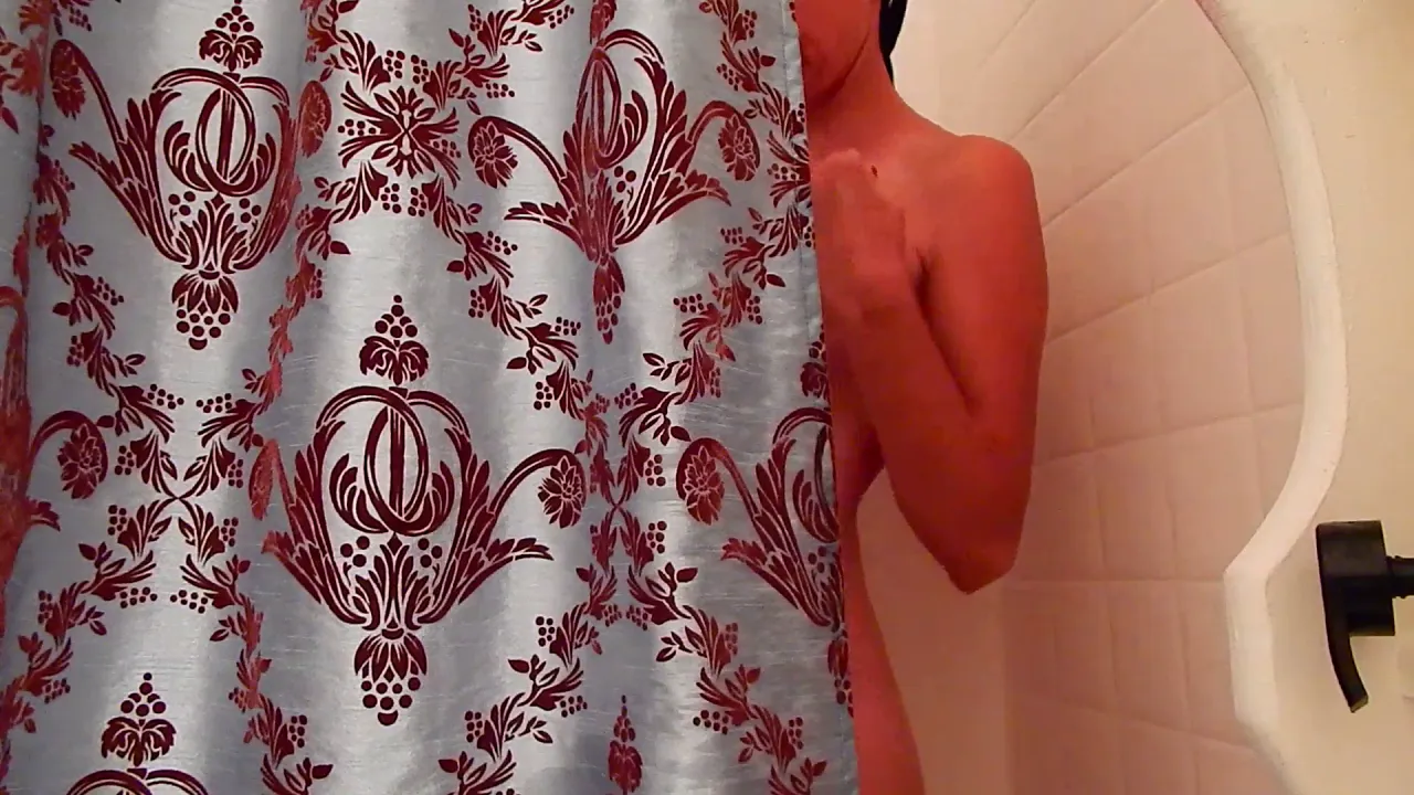 Naked girl teases herself in the shower with soapy masturbation