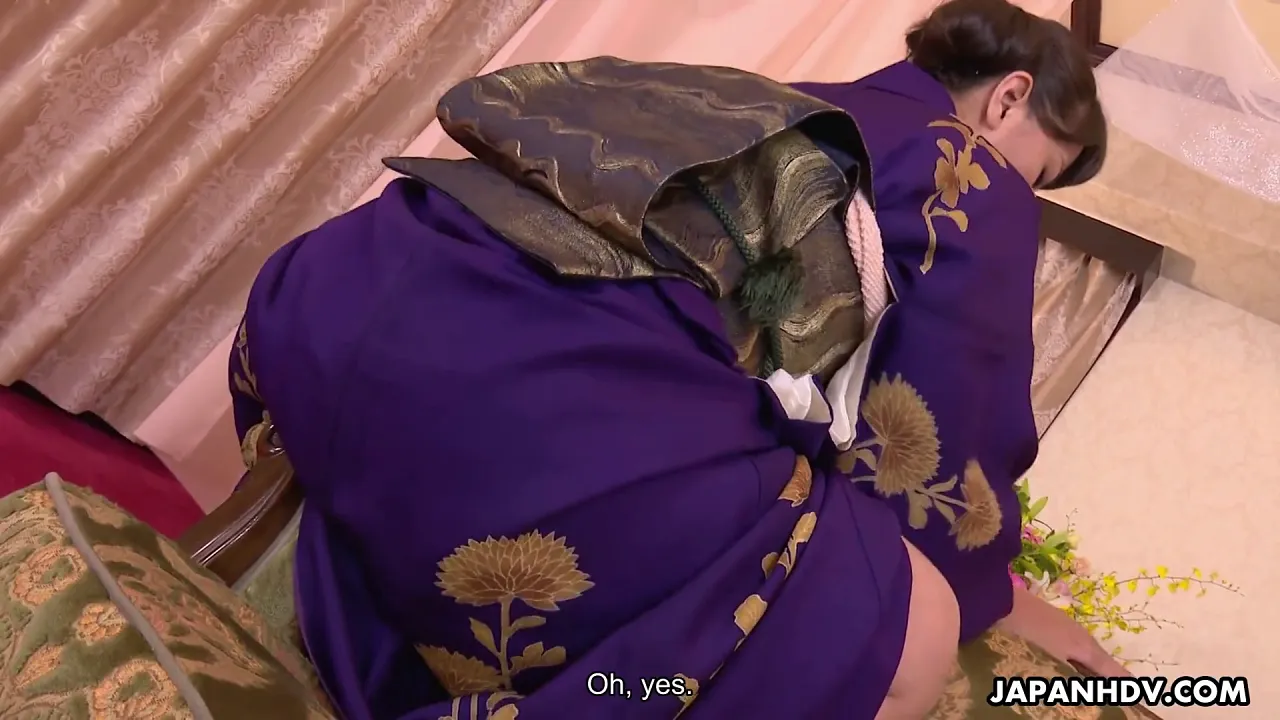 Elegant Japanese brunette with big tits masturbates in her kimono