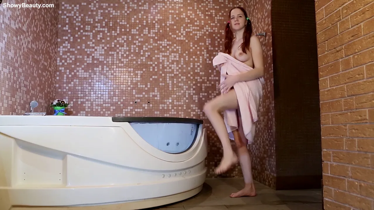 Nika poses erotically while soaking in a jacuzzi solo