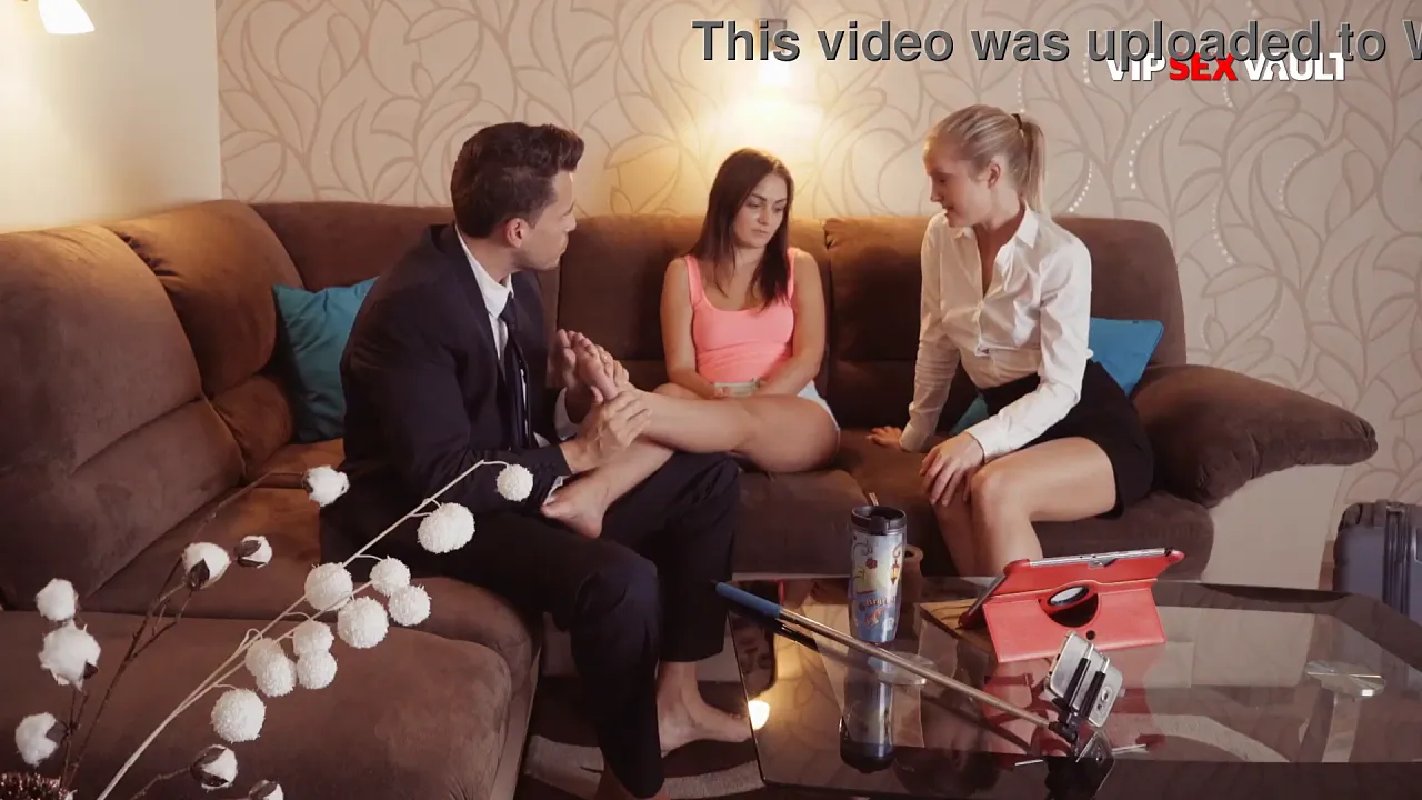 Blonde and brunette have a hot lesbian threesome on the couch