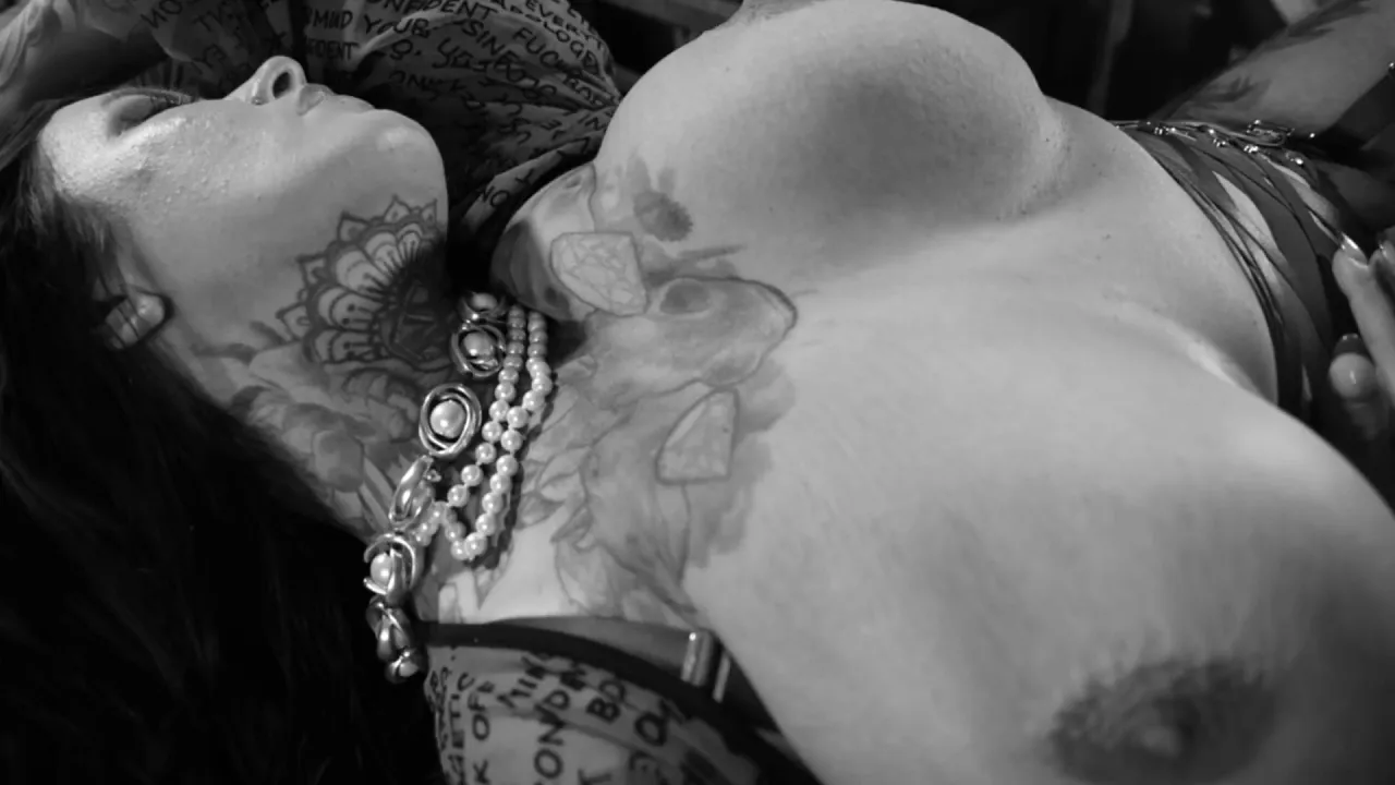 Sabien Demonia teases in black and white with her huge tattooed BBW tits and red stockings