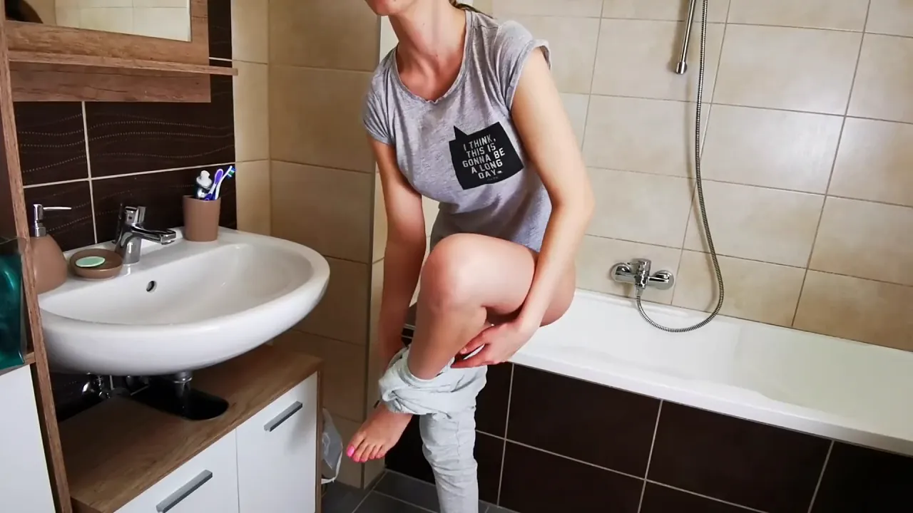 Nidalee plays alone in a bathroom