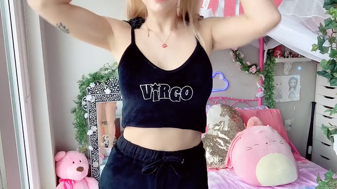 Indigo White undresses and shows off her feet in a dressing room