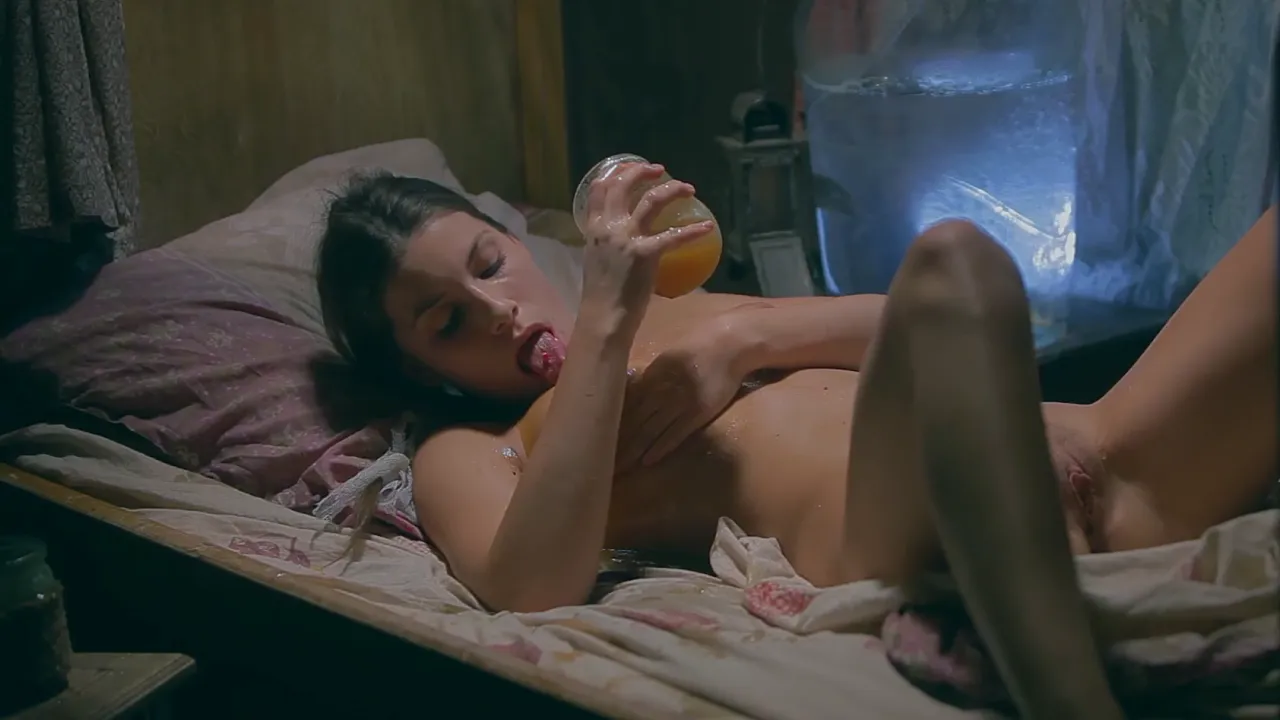 Natural big-titted white girl masturbates with cucumber in the dark