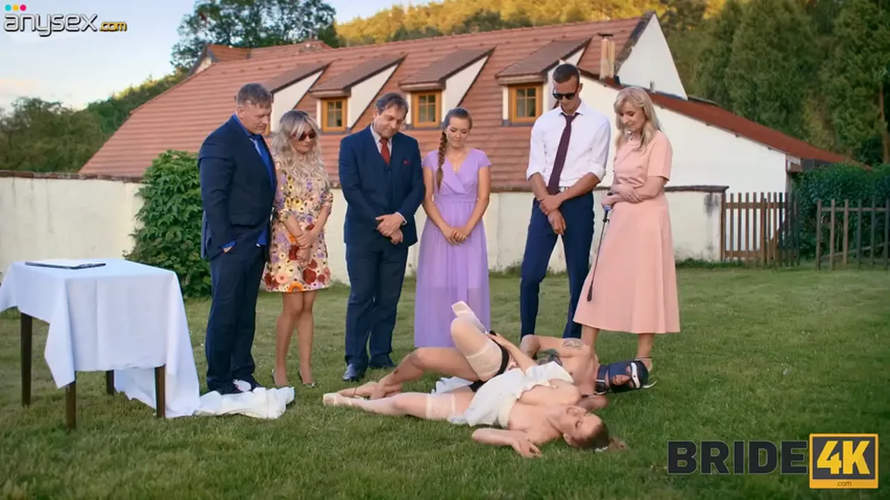 Kinky bride fucked by masked sex slave in wedding dress during outdoor ceremony