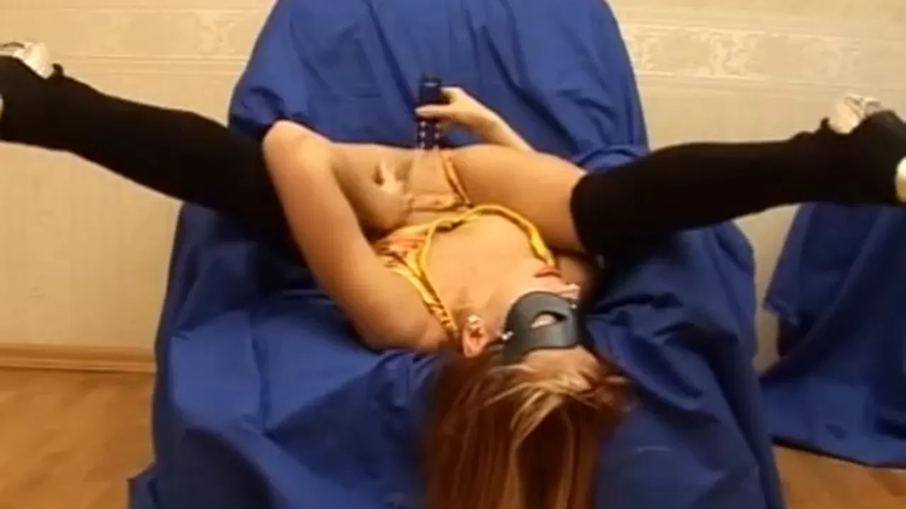 Flexible Russian blonde stripper poses and spreads her shaved pussy for a dildo