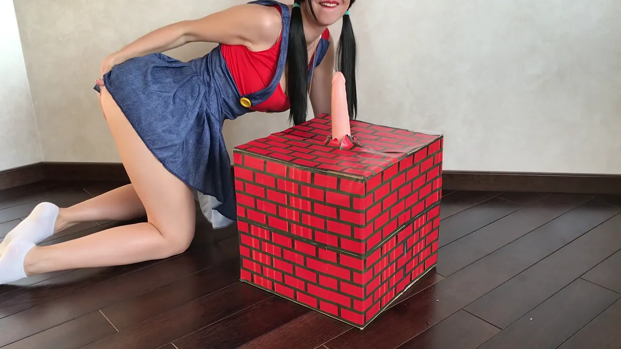 Brunette in Super Mario cosplay masturbates with a dildo and fingers