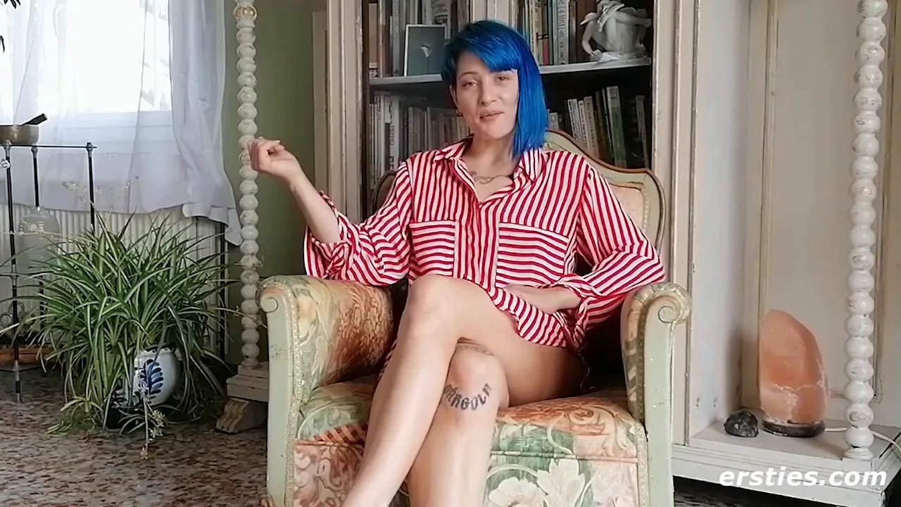 Tattooed woman plays with toys for pleasure
