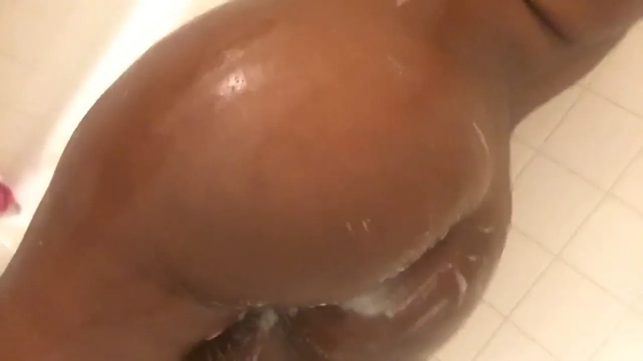 Solo big-titted girl strips and teases in the shower