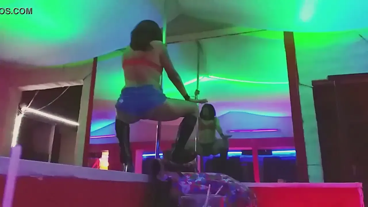 Sexy stripper dances naked on a pole at the strip club