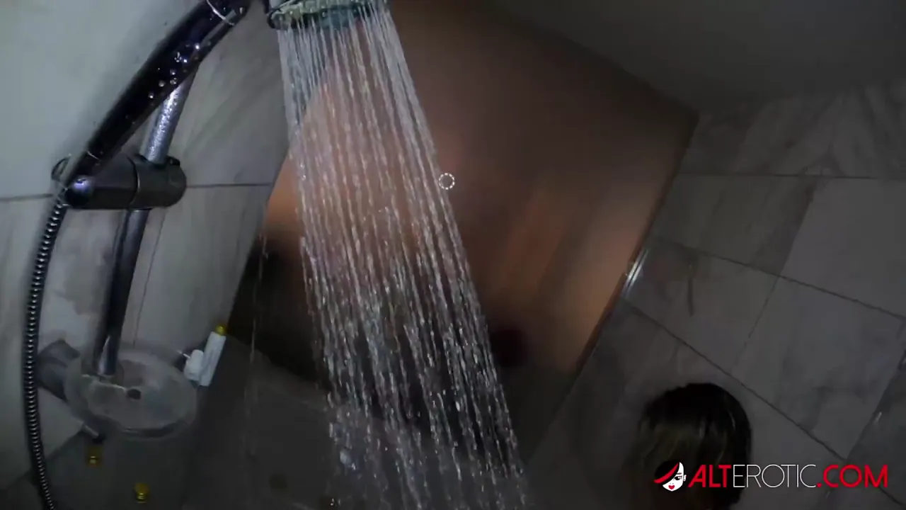 Tattooed blonde Adalind Gray masturbates with a toy while taking a shower