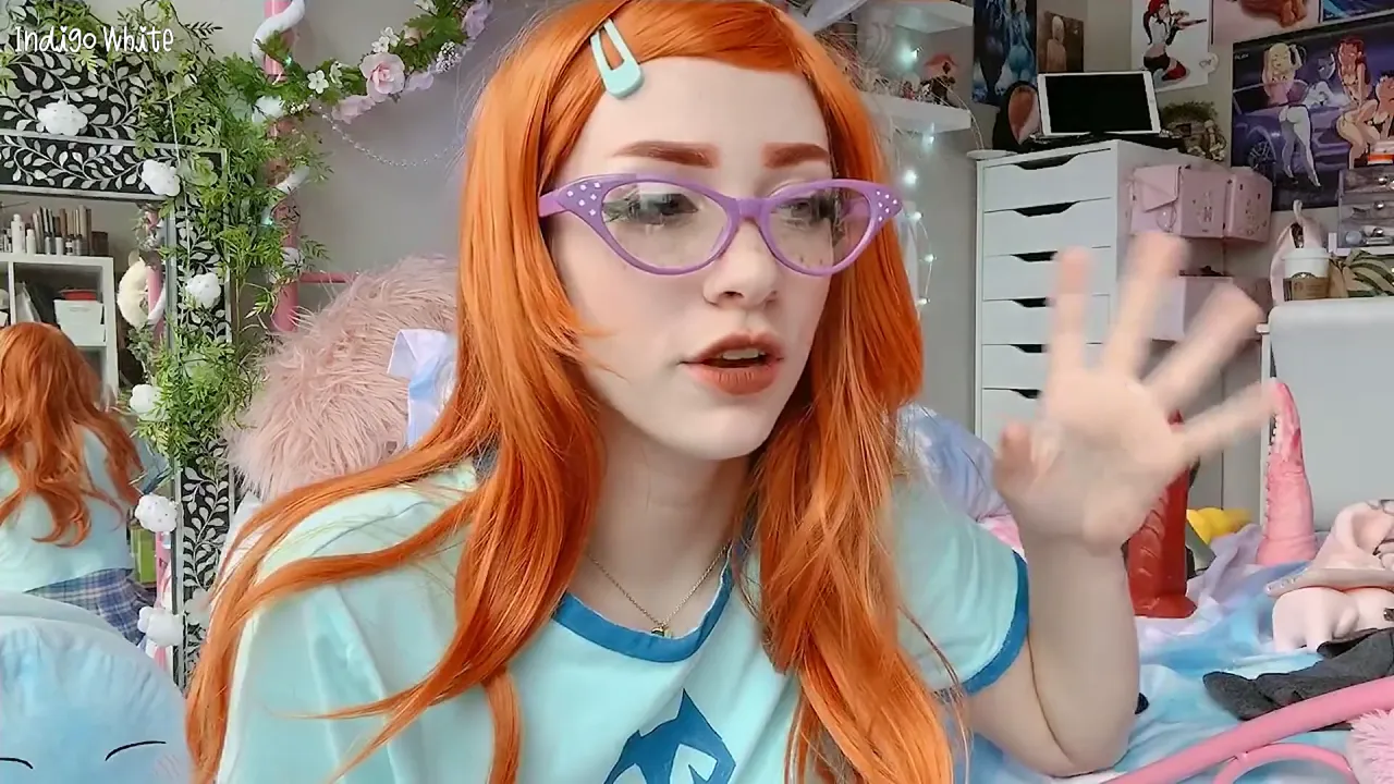 Redhead cosplay babe Gwen Tennyson uses a big toy and gives POV blowjob